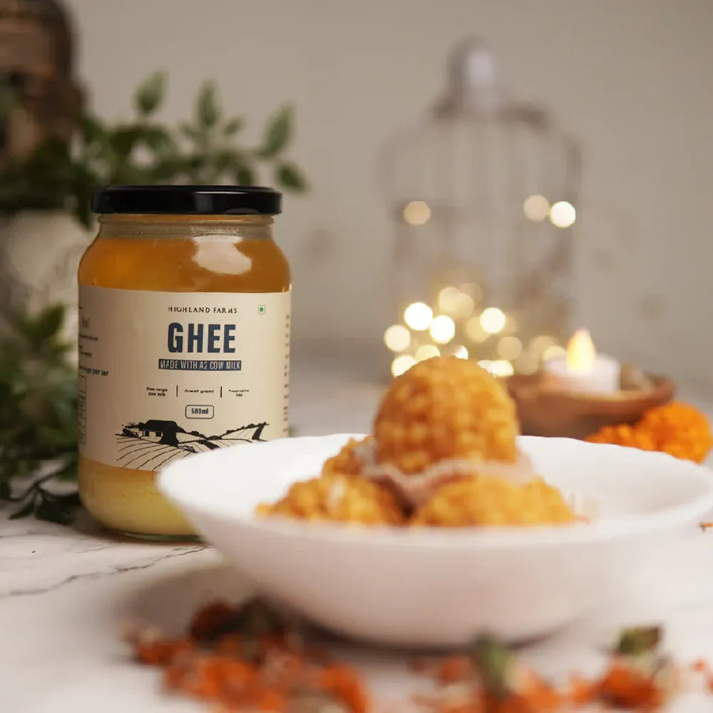 A2 cow ghee served with fresh laddus showing rich texture and traditional use in Indian sweets and cooking