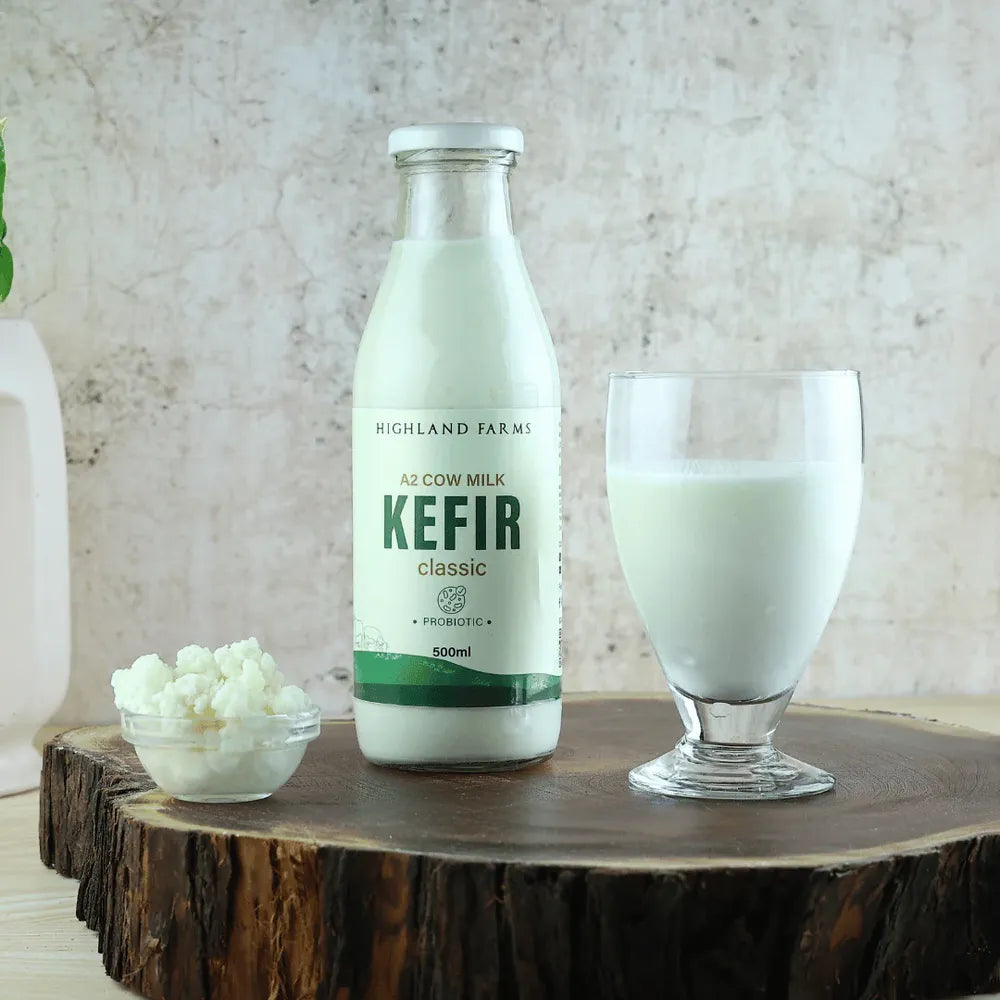 A2 kefir probiotic drink served in glass with bottle on wooden table showing healthy daily consumption for gut health