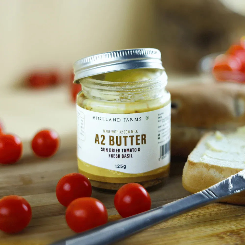 A2 sundried tomato and basil butter jar with fresh cherry tomatoes and bread Highland Farms flavored butter for pasta and bread