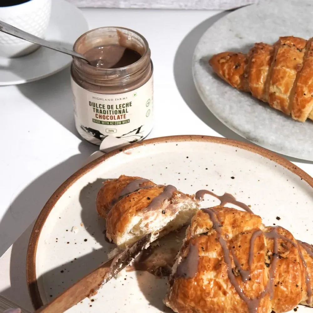 Chocolate dulce de leche spread on croissant thick creamy dessert topping