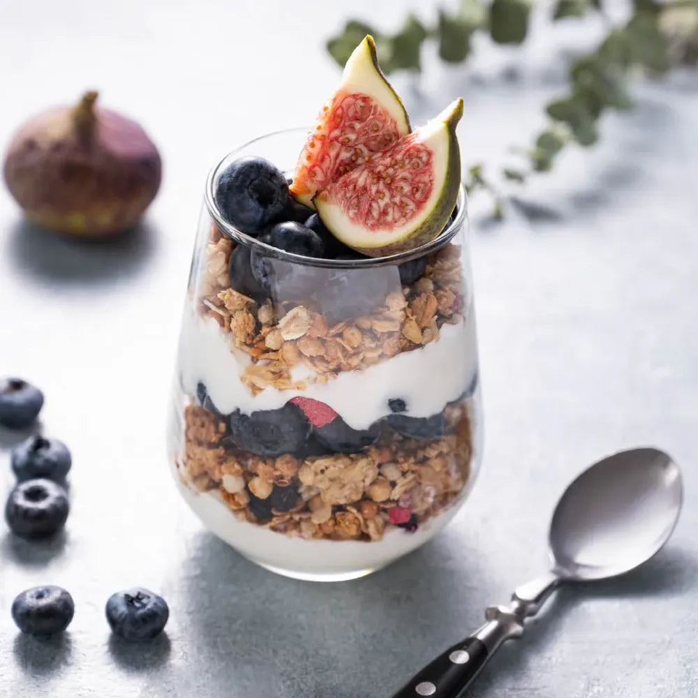 Greek yogurt fruit parfait healthy dessert snack with granola and fresh fruits